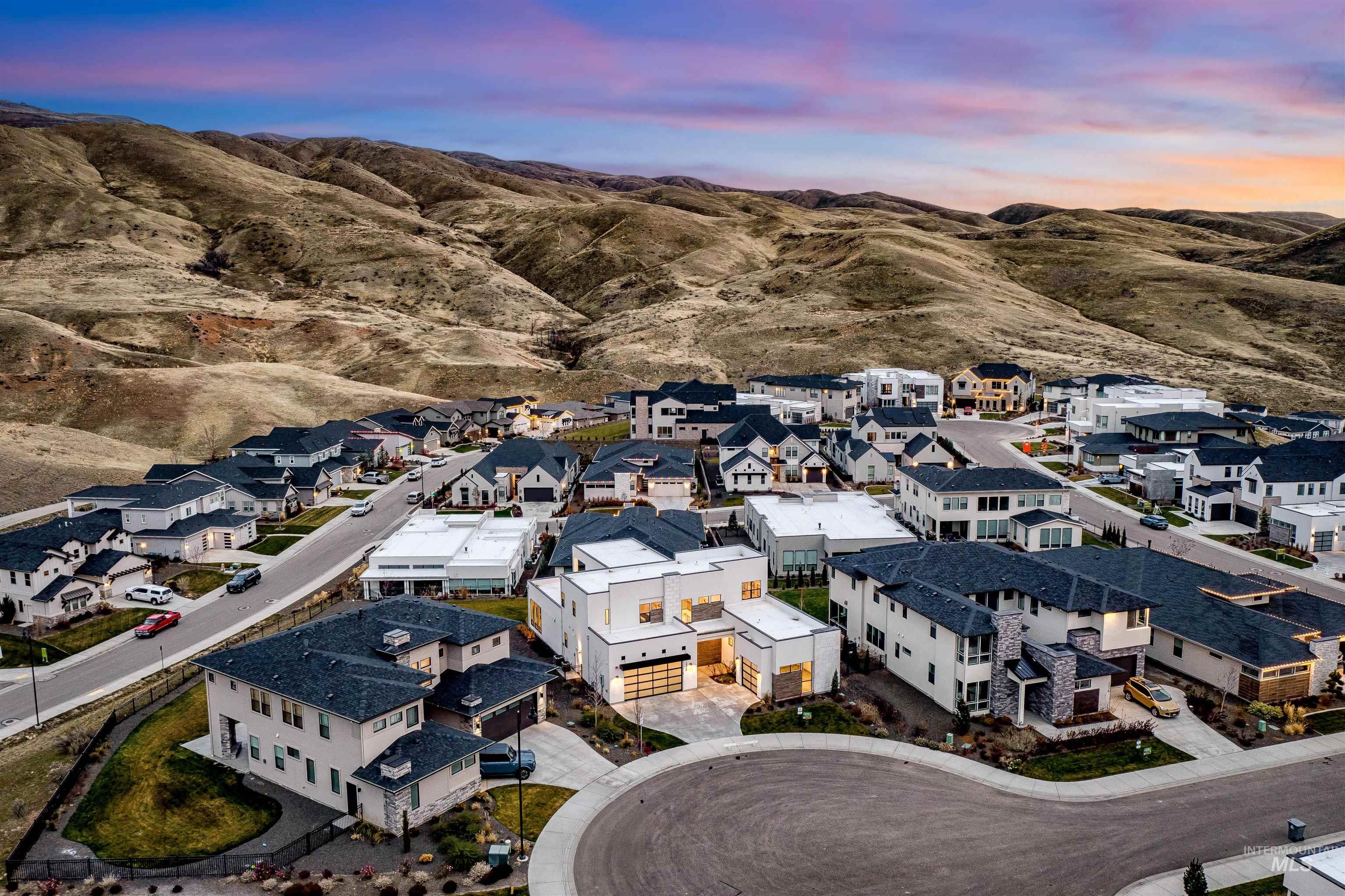 2528 South Linnet Place Boise, ID 83716 - Photo 2 of 33 Aerial perspective of suburban area with a mountainous background