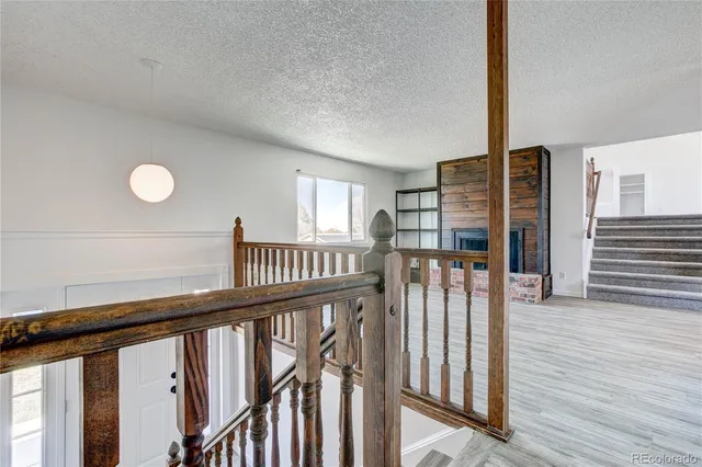 a view of staircase with wooden floor and stairs