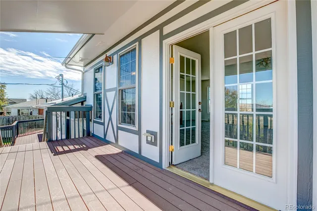 a view of a balcony with wooden floor