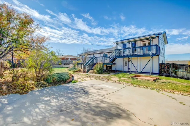 a view of a house with basketball court