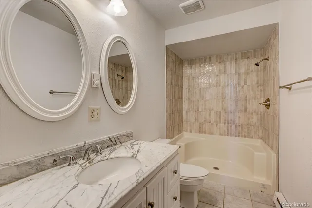 a bathroom with a shower and a bathtub