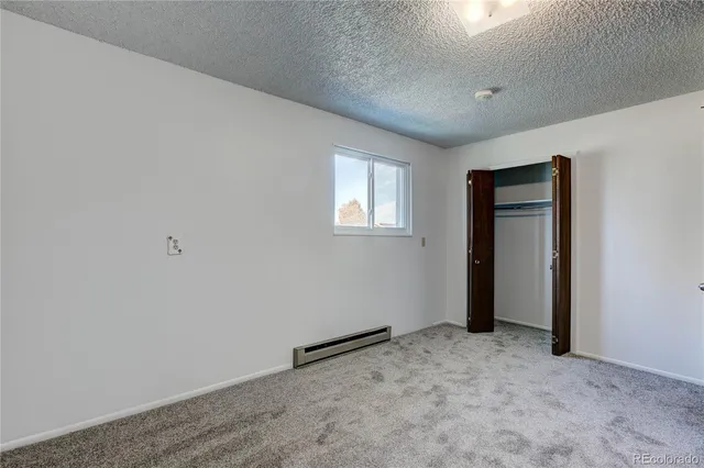 an empty room with a empty space and window