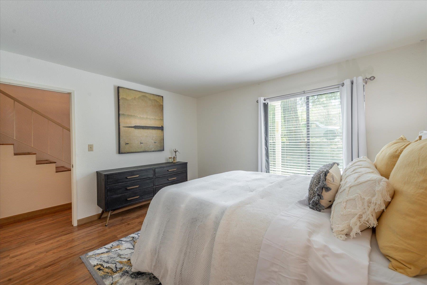 10272 Schaffer Drive Truckee, CA 96161 - Photo 14 of 20 a bedroom with a bed and wooden floor