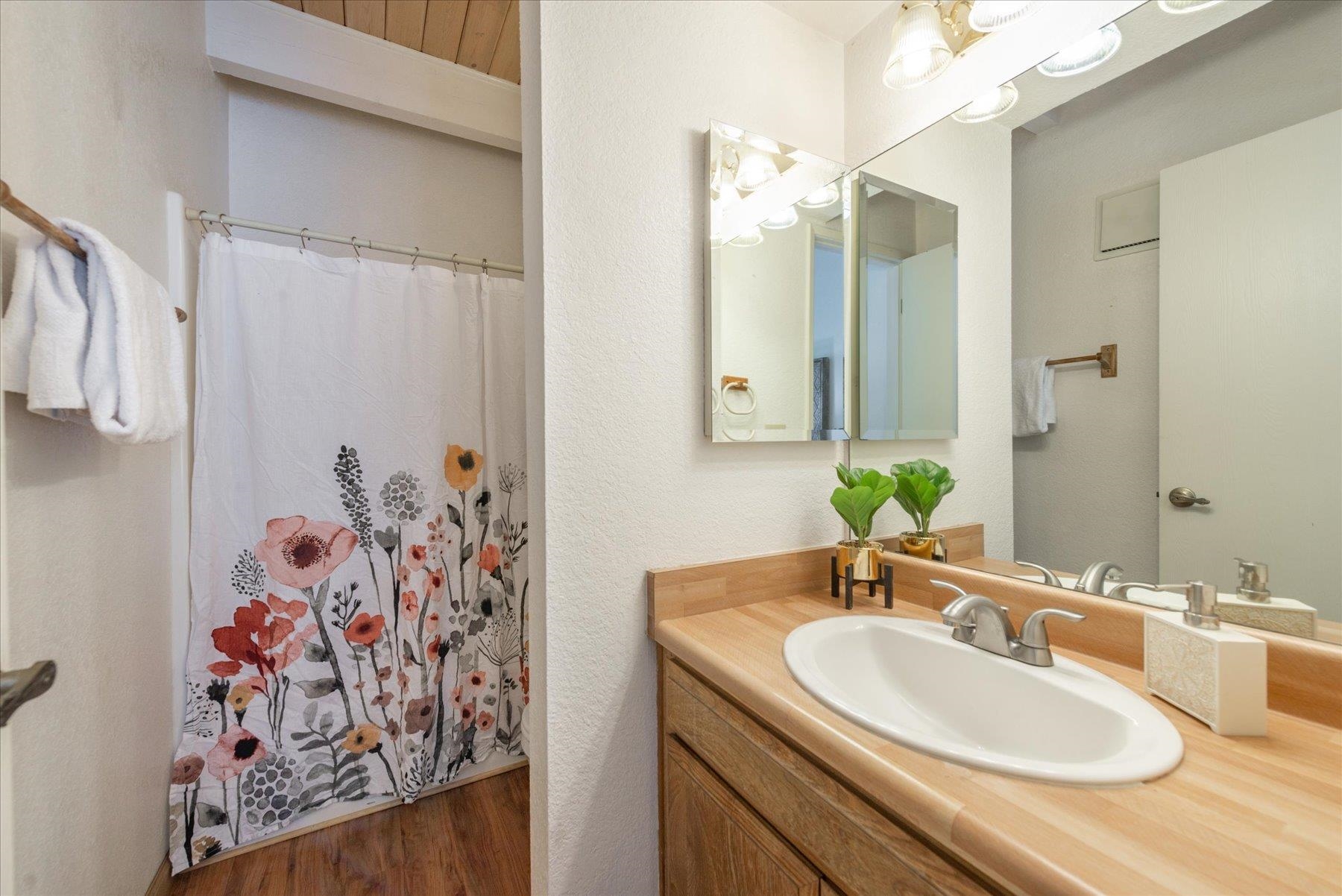 10272 Schaffer Drive Truckee, CA 96161 - Photo 15 of 20 a bathroom with a granite countertop sink and a mirror