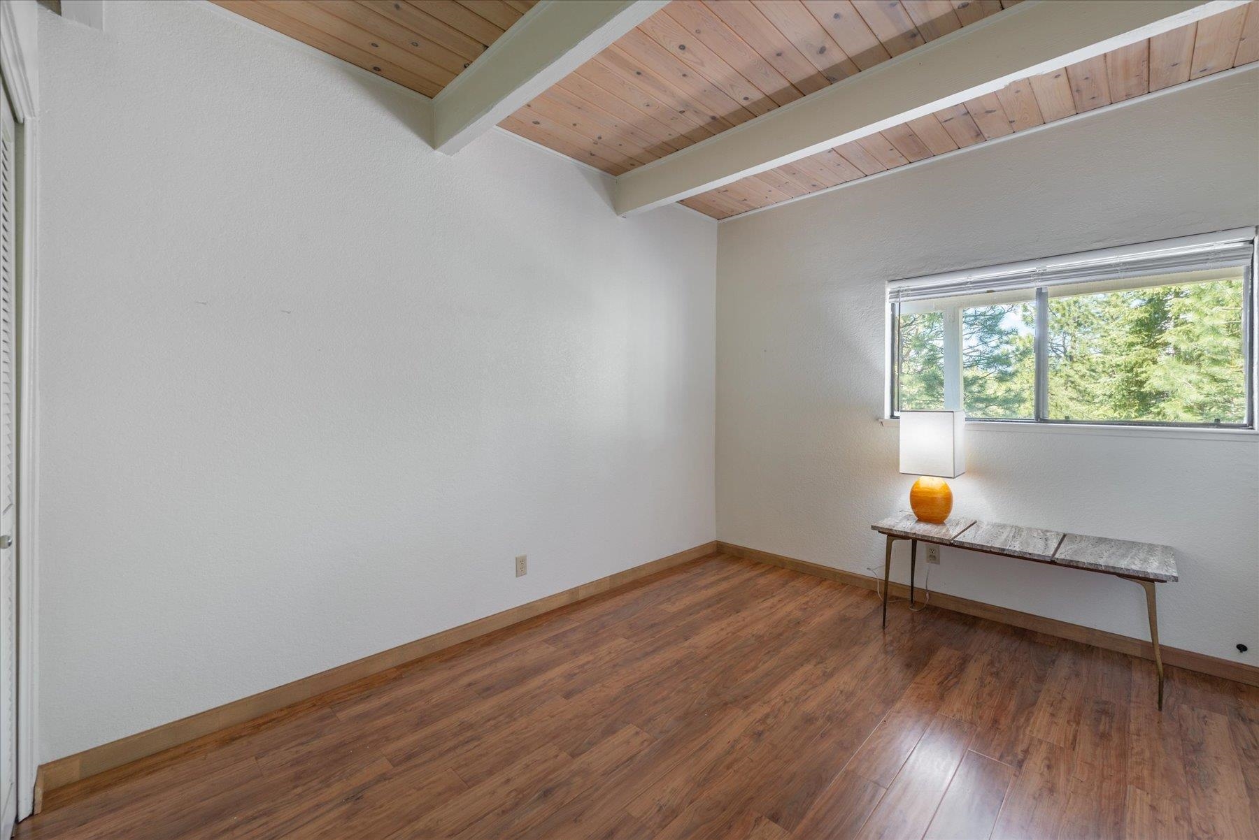 10272 Schaffer Drive Truckee, CA 96161 - Photo 17 of 20 a view of an empty room with wooden floor and a window