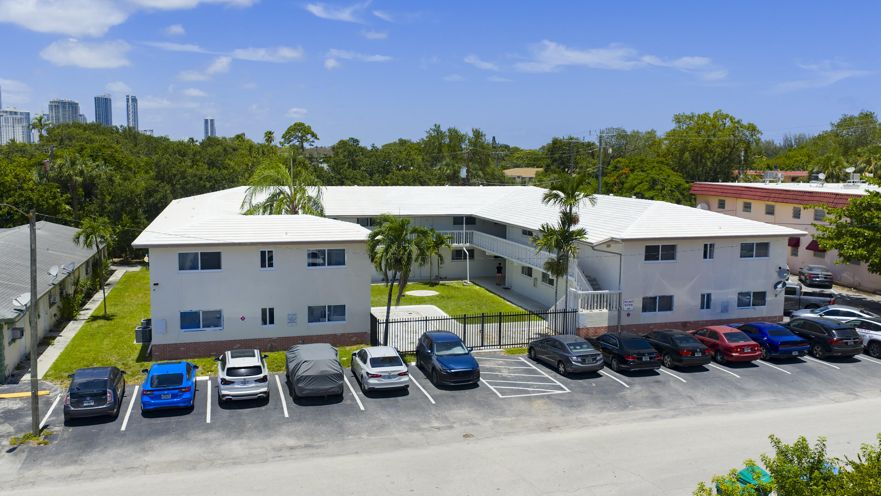 a view of a patio with table and chairs potted plants and a fountain