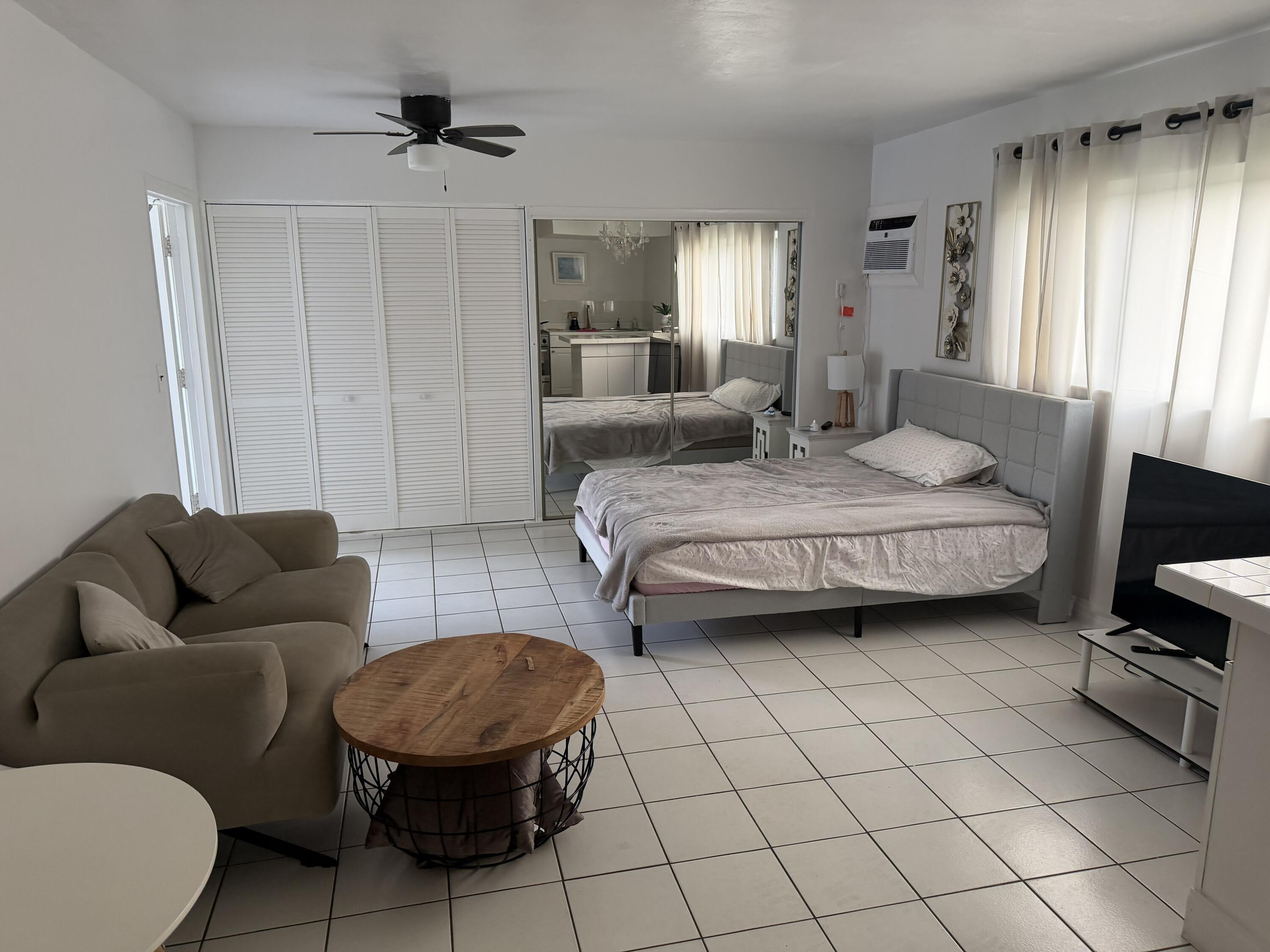 811 Southeast 16th Street Fort Lauderdale, FL 33316 - Photo 12 of 25 a bedroom with a bed and window