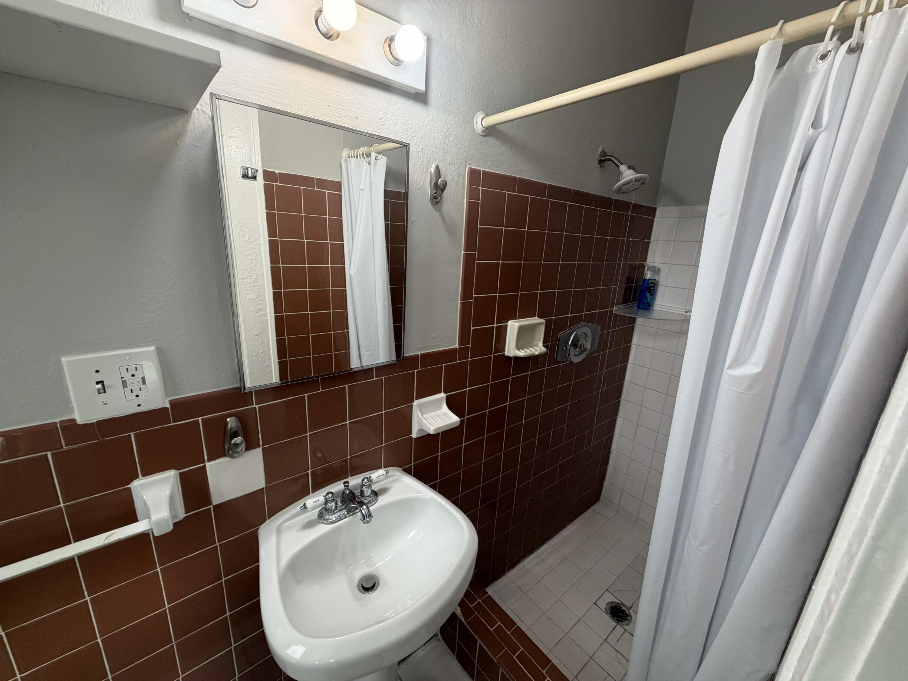 811 Southeast 16th Street Fort Lauderdale, FL 33316 - Photo 24 of 25 a bathroom with a sink mirror vanity and toilet
