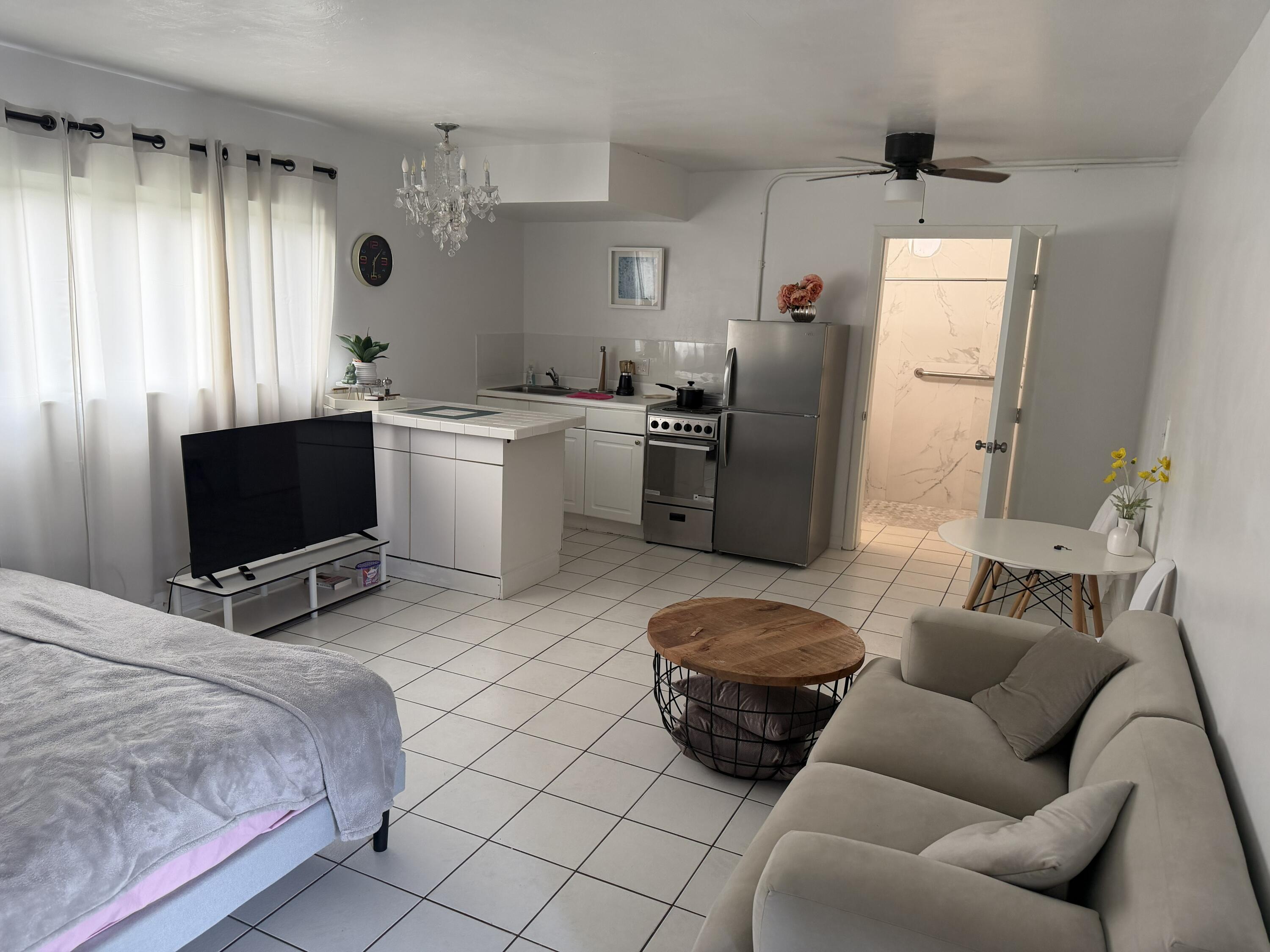 811 Southeast 16th Street Fort Lauderdale, FL 33316 - Photo 8 of 25 a bedroom with furniture and a flat screen tv