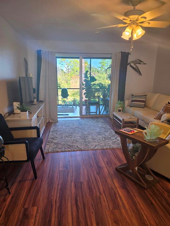 6800 Placida Road, Unit 167 Englewood, FL 34224 - Photo 11 of 44 a workspace with furniture a rug and wooden floor