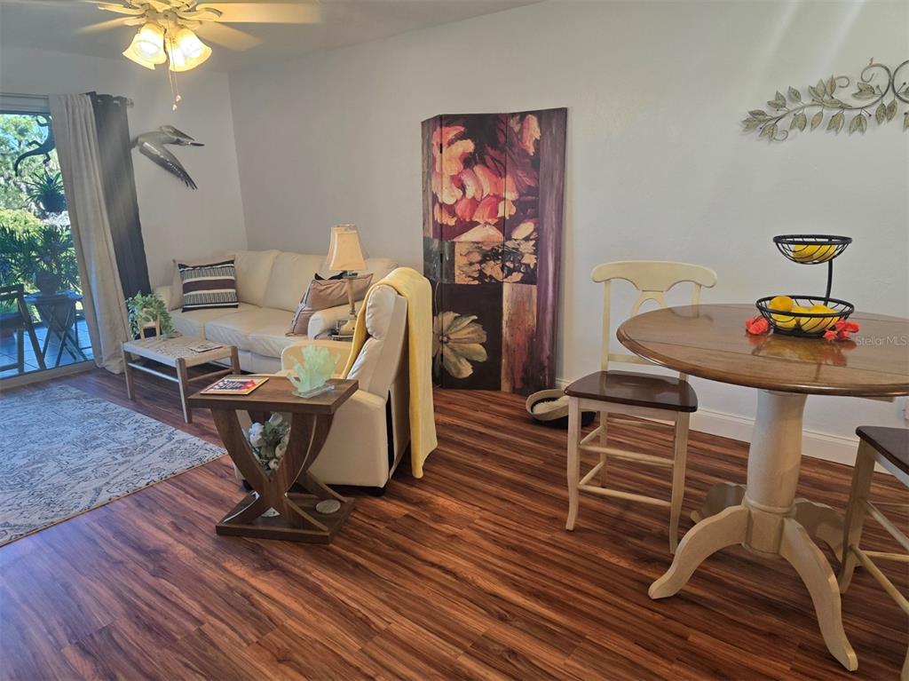 6800 Placida Road, Unit 167 Englewood, FL 34224 - Photo 12 of 44 a living room with furniture and wooden floor
