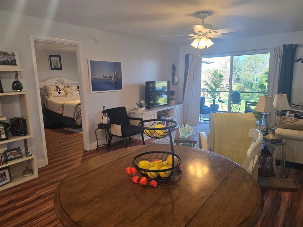 6800 Placida Road, Unit 167 Englewood, FL 34224 - Photo 13 of 44 a living room with furniture and a large window