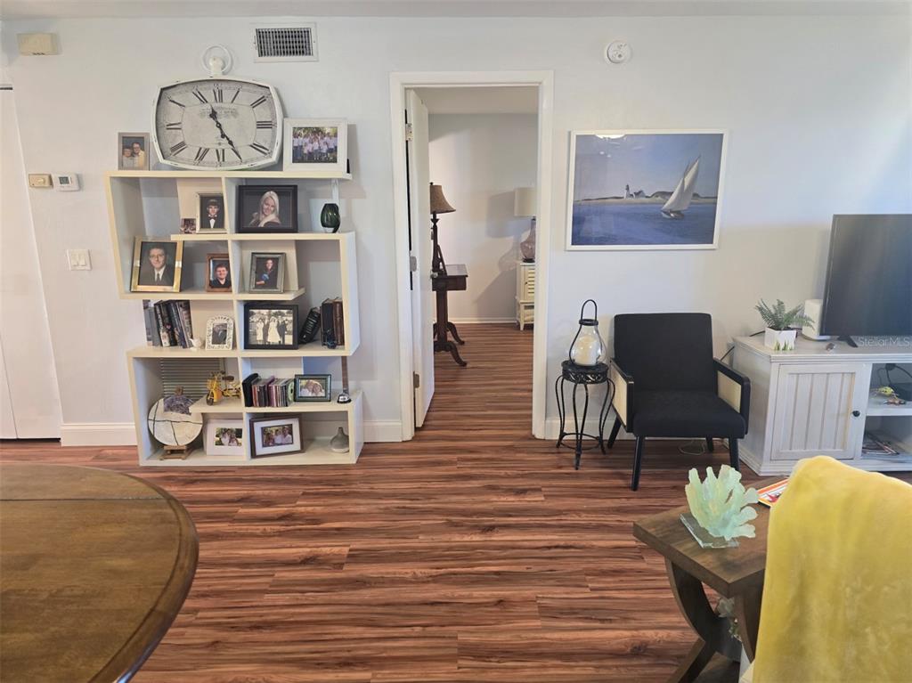 6800 Placida Road, Unit 167 Englewood, FL 34224 - Photo 15 of 44 a view of a workspace with furniture and wooden floor