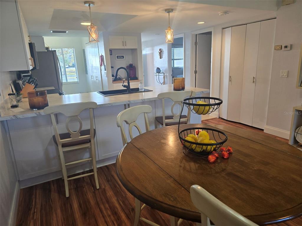 6800 Placida Road, Unit 167 Englewood, FL 34224 - Photo 16 of 44 a living room with furniture and wooden floor