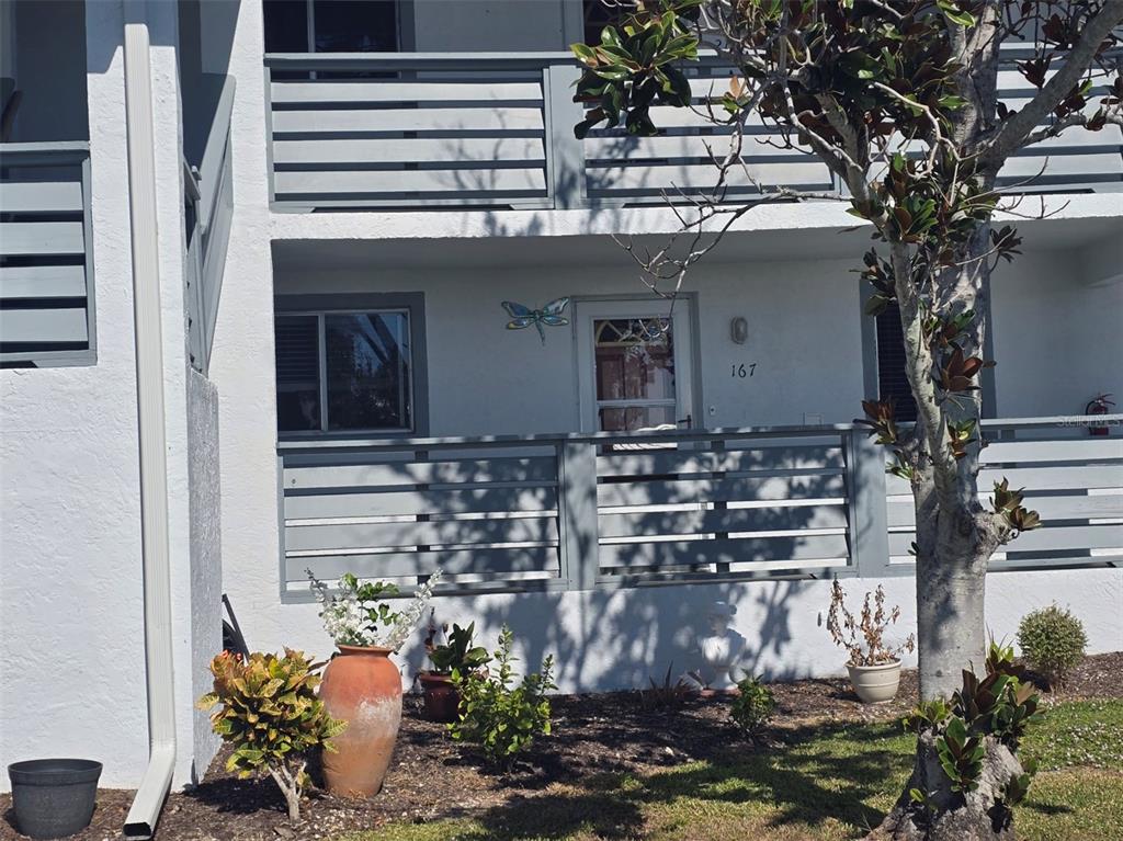 6800 Placida Road, Unit 167 Englewood, FL 34224 - Photo 2 of 44 a front view of a house with chairs