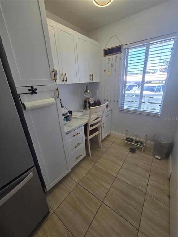 6800 Placida Road, Unit 167 Englewood, FL 34224 - Photo 21 of 44 a utility room with cabinets dryer and washer