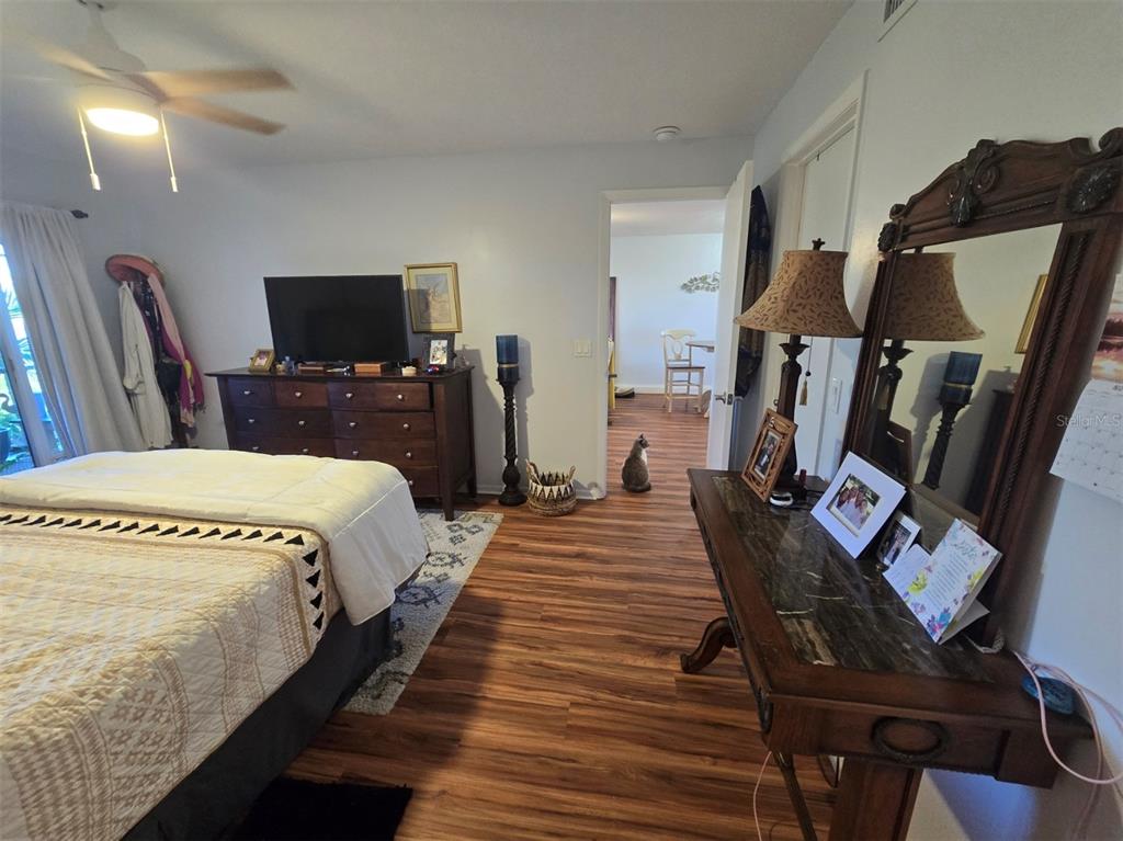 6800 Placida Road, Unit 167 Englewood, FL 34224 - Photo 24 of 44 a bedroom with bed a flat tv screen and dresser