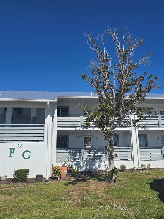 6800 Placida Road, Unit 167 Englewood, FL 34224 - Photo 3 of 44 a front view of house with yard
