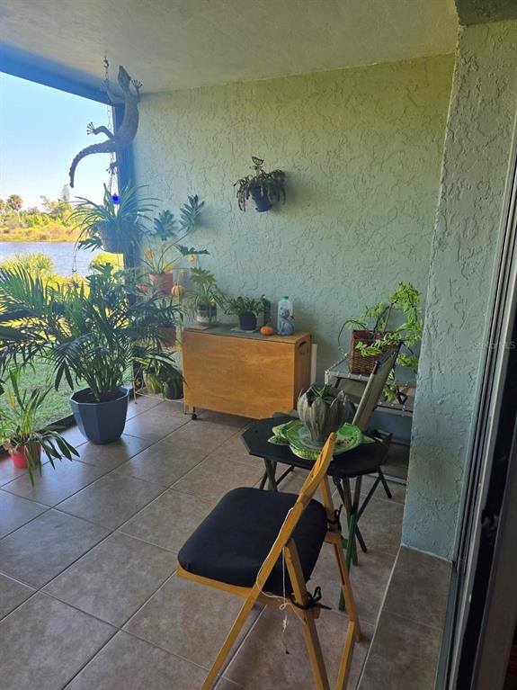 6800 Placida Road, Unit 167 Englewood, FL 34224 - Photo 31 of 44 a view of a workspace room with furniture and potted plant