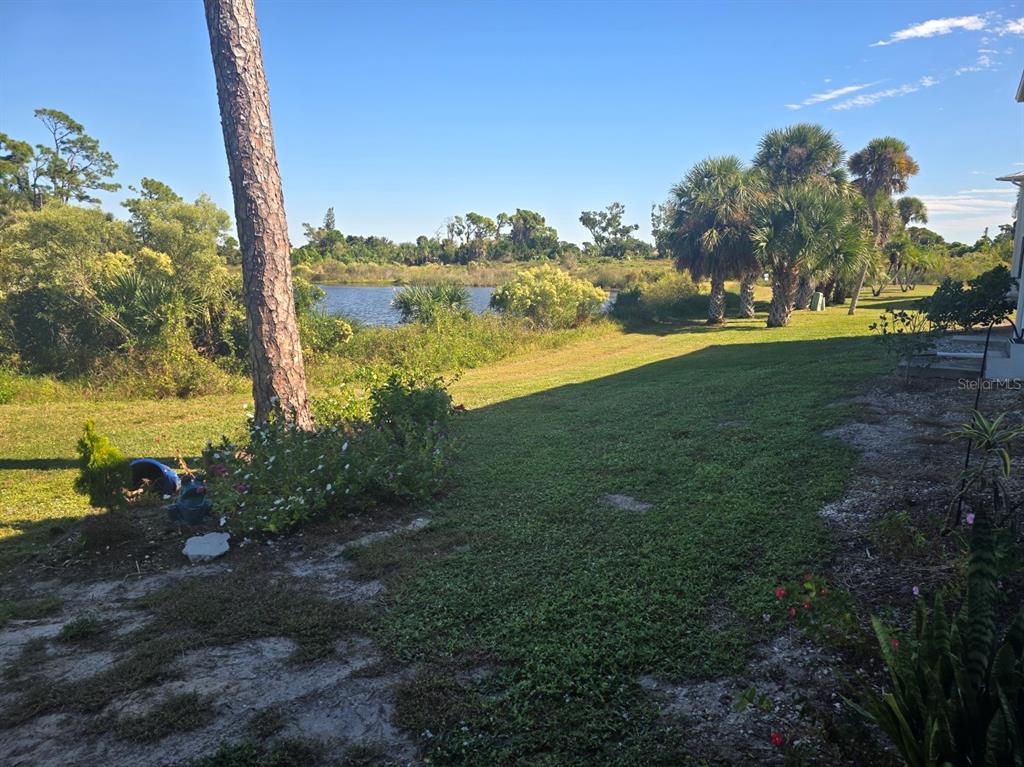 6800 Placida Road, Unit 167 Englewood, FL 34224 - Photo 36 of 44 a view of a yard with an ocean view