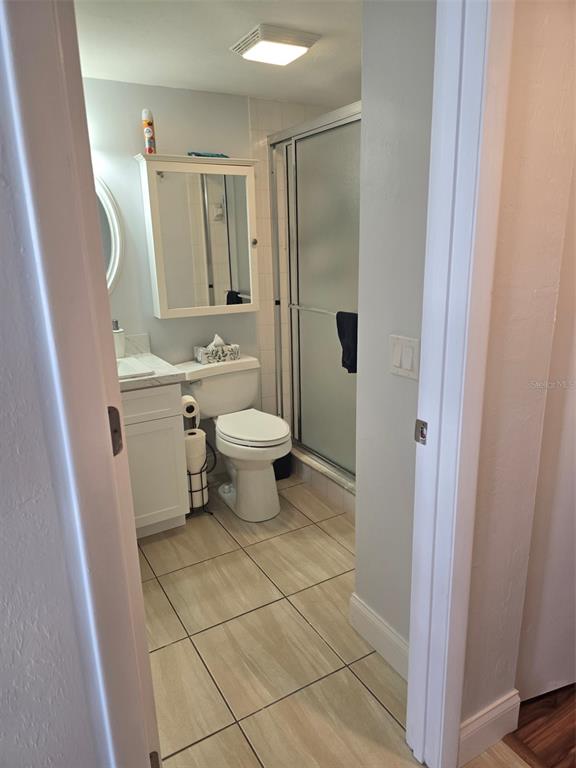 6800 Placida Road, Unit 167 Englewood, FL 34224 - Photo 9 of 44 a bathroom with a toilet a sink and shower