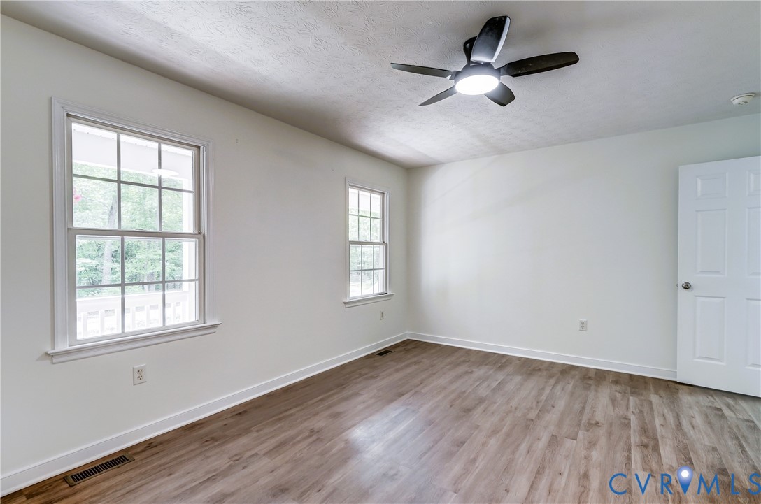 3820 Mt Pleasant Road Providence Forge, VA 23140 - Photo 12 of 40 a view of empty room with wooden floor and fan