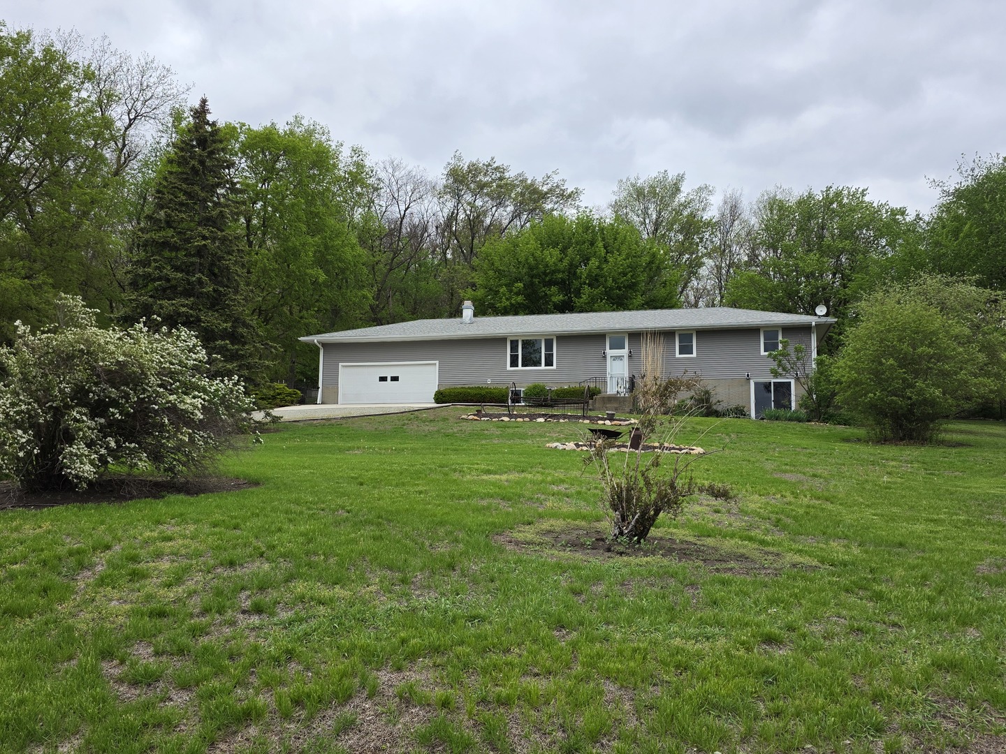 15510 Lomax Road Prophetstown, IL 61277 - Photo 3 of 24 a front view of a house with garden