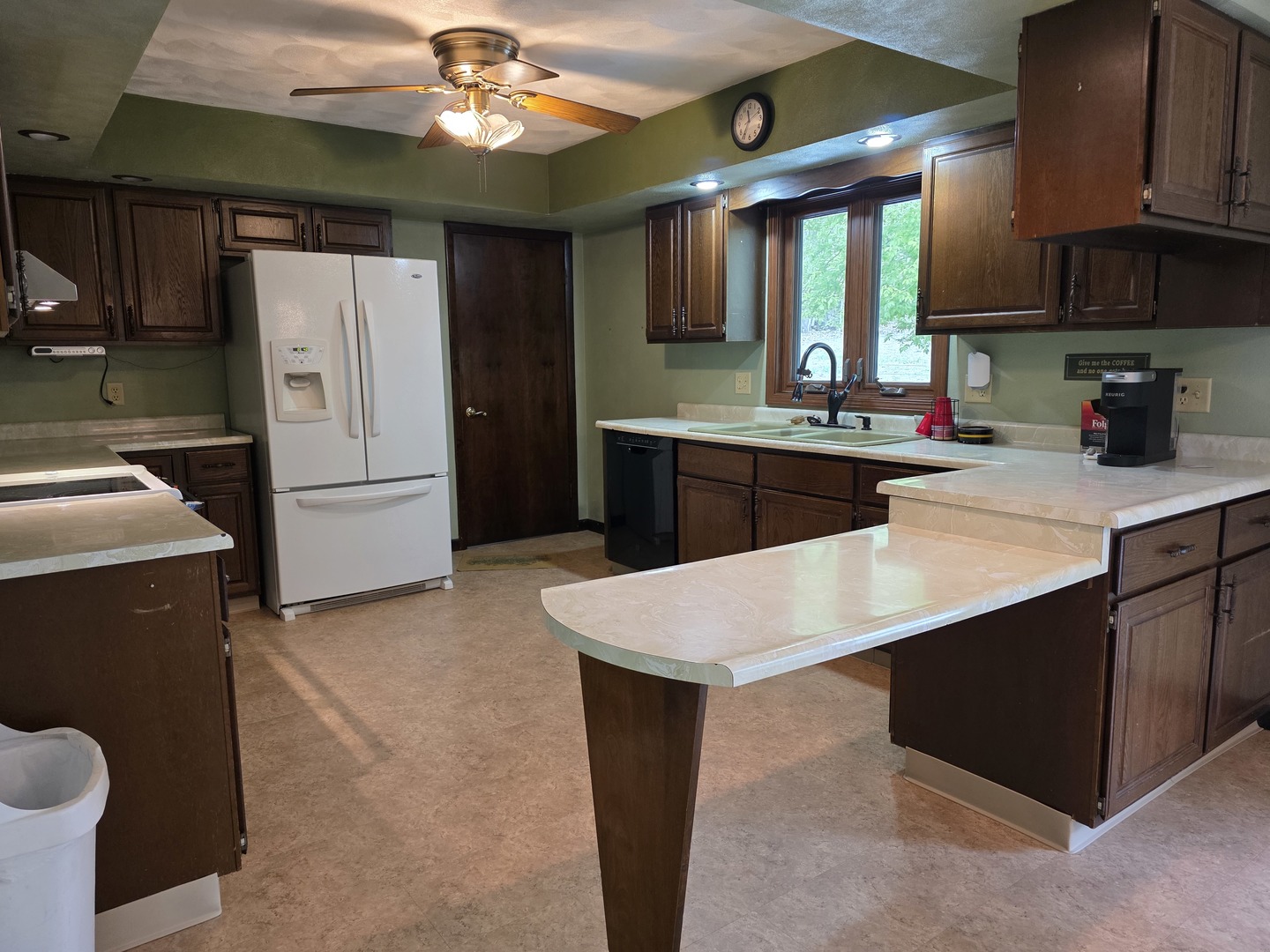 15510 Lomax Road Prophetstown, IL 61277 - Photo 6 of 24 a kitchen with a sink a stove and refrigerator