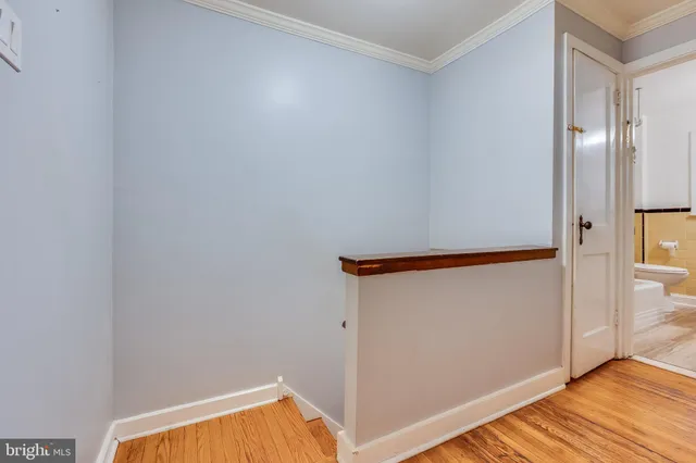a view of walk in closet with empty room