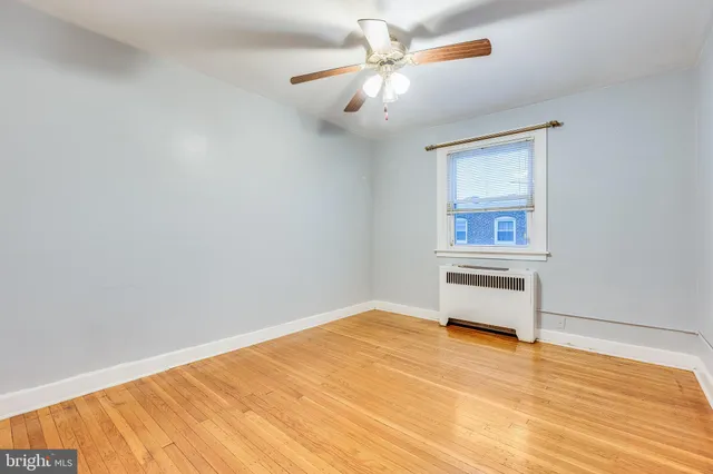 a view of a room with a wooden floor