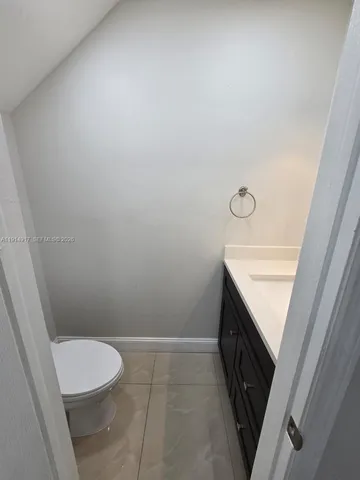 a bathroom with a sink a toilet and vanity