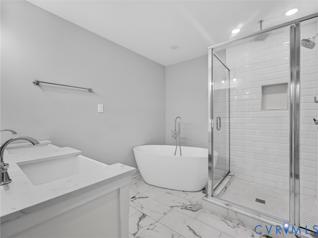 9011 Midway Road Henrico, VA 23229 - Photo 53 of 65 Contemporary bathroom featuring a freestanding tub