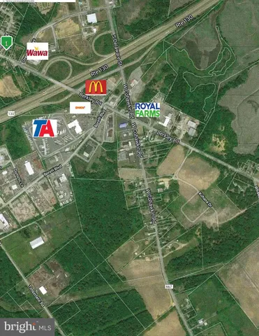 a view of a lake with houses in the back