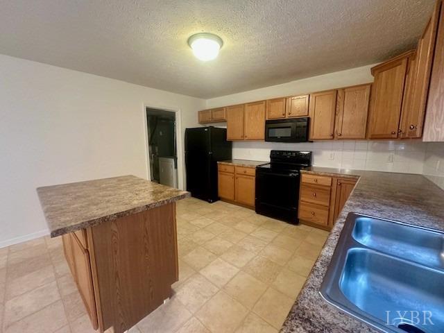 1095 Middle View Drive Forest, VA 24551 - Photo 11 of 25 a kitchen with stainless steel appliances granite countertop a stove top oven a sink and a refrigerator
