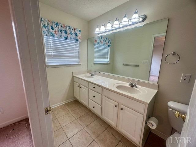 1095 Middle View Drive Forest, VA 24551 - Photo 13 of 25 a spacious bathroom with a double vanity sink mirror and toilet