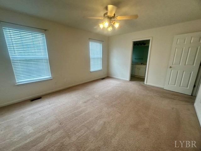 1095 Middle View Drive Forest, VA 24551 - Photo 15 of 25 an empty room with windows and fan