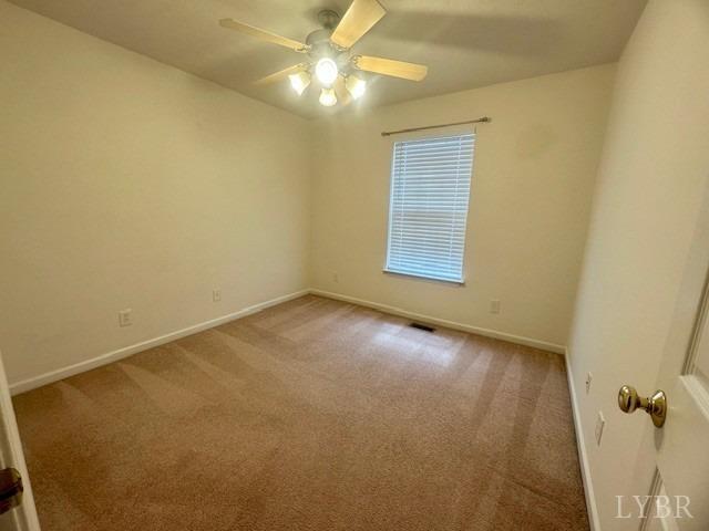 1095 Middle View Drive Forest, VA 24551 - Photo 18 of 25 an empty room with a fan & a window