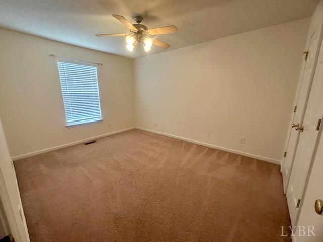 1095 Middle View Drive Forest, VA 24551 - Photo 20 of 25 an empty room with a window and a fan