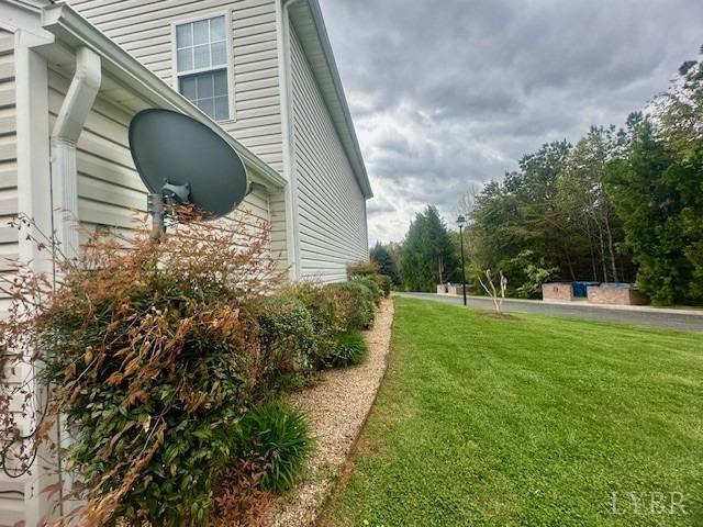1095 Middle View Drive Forest, VA 24551 - Photo 24 of 25 a backyard of a house with plants and large tree