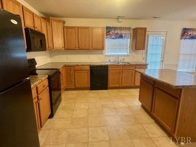 1095 Middle View Drive Forest, VA 24551 - Photo 6 of 25 a kitchen with stainless steel appliances granite countertop a sink stove and microwave