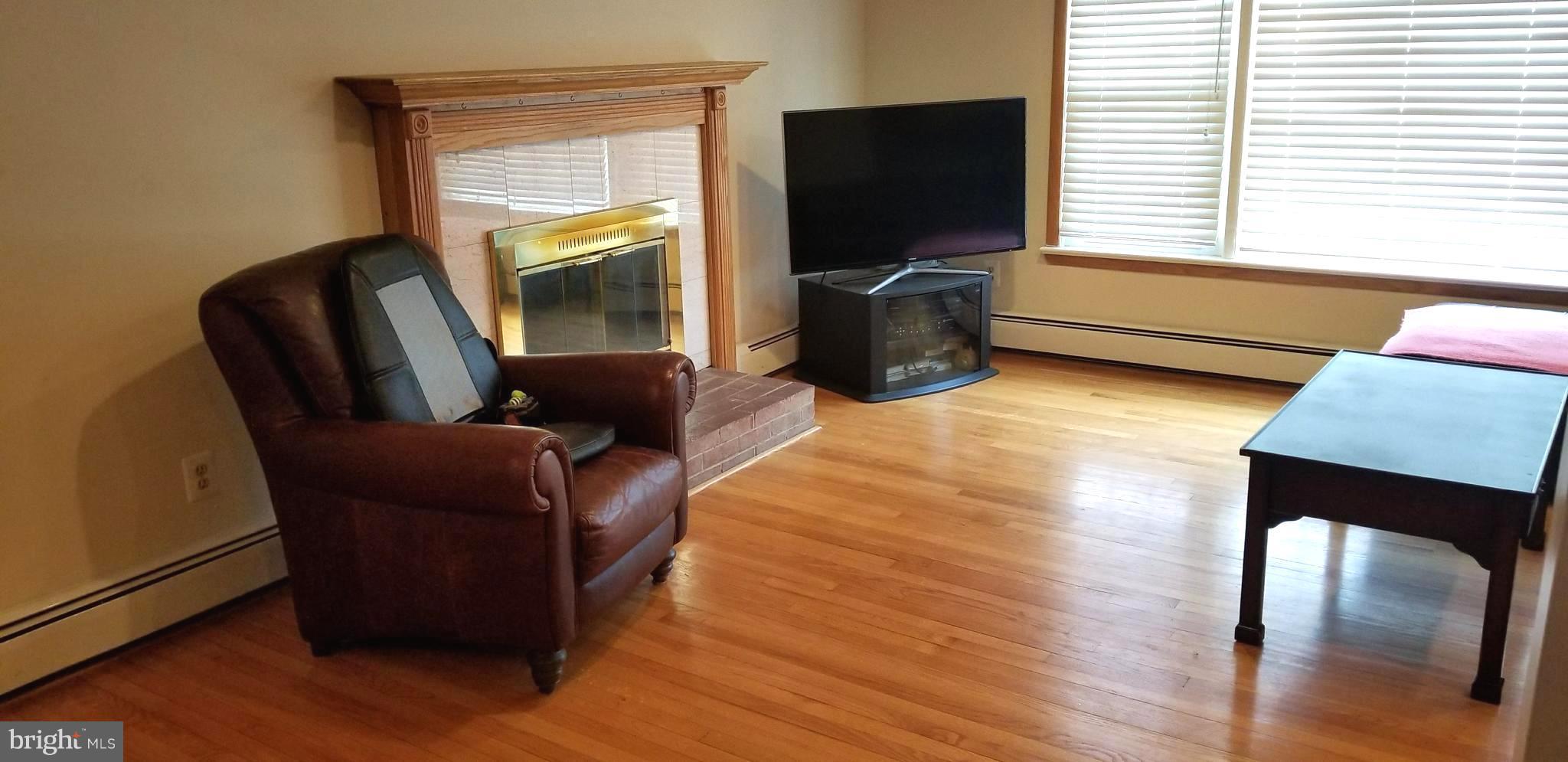 1052 Utterback Store Road Great Falls, VA 22066 - Photo 5 of 30 Living Room w/Woodburning Fireplace