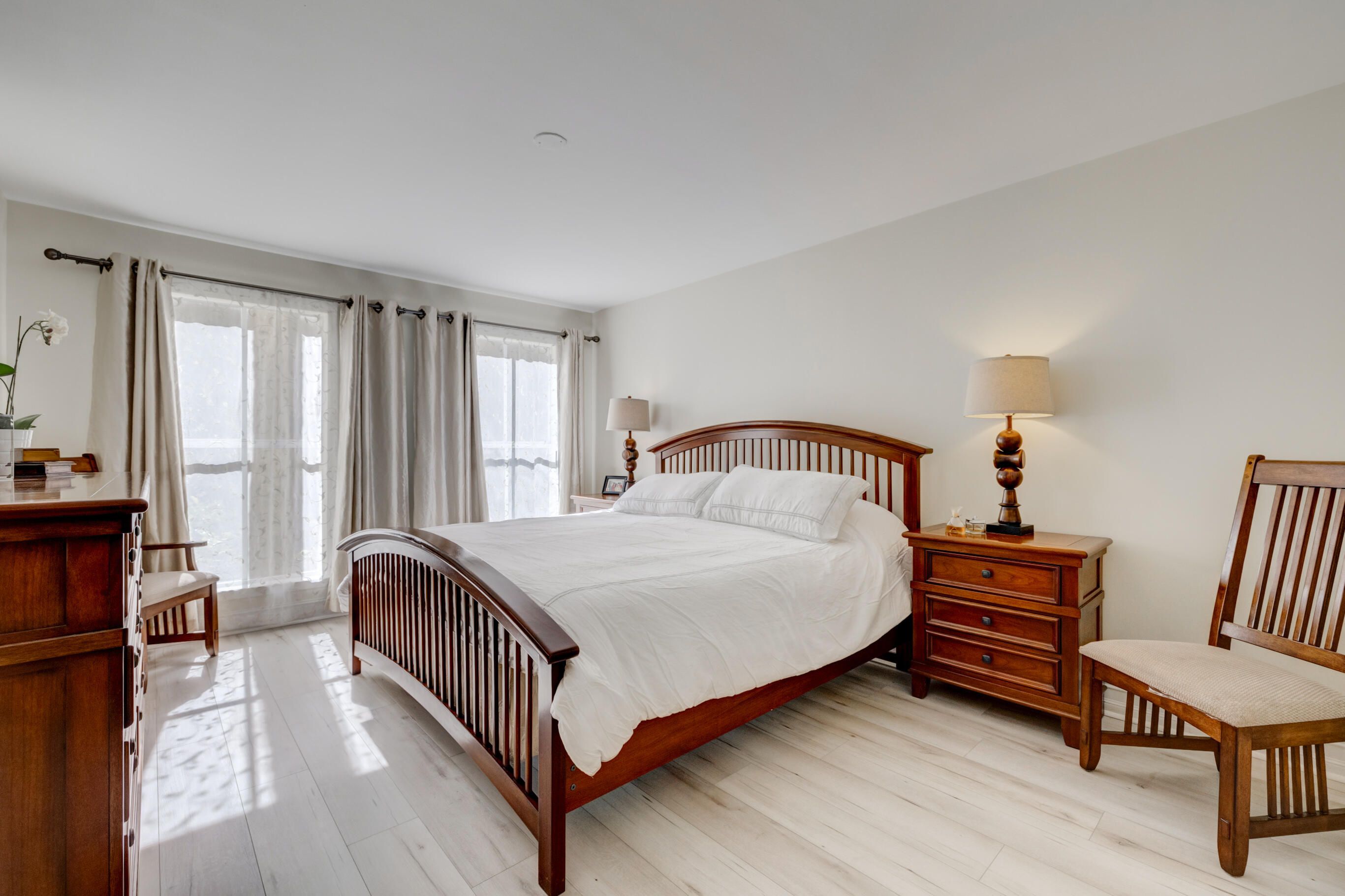995 Riverside Drive, Unit 111 Coral Springs, FL 33071 - Photo 11 of 24 a bedroom with a bed and a window