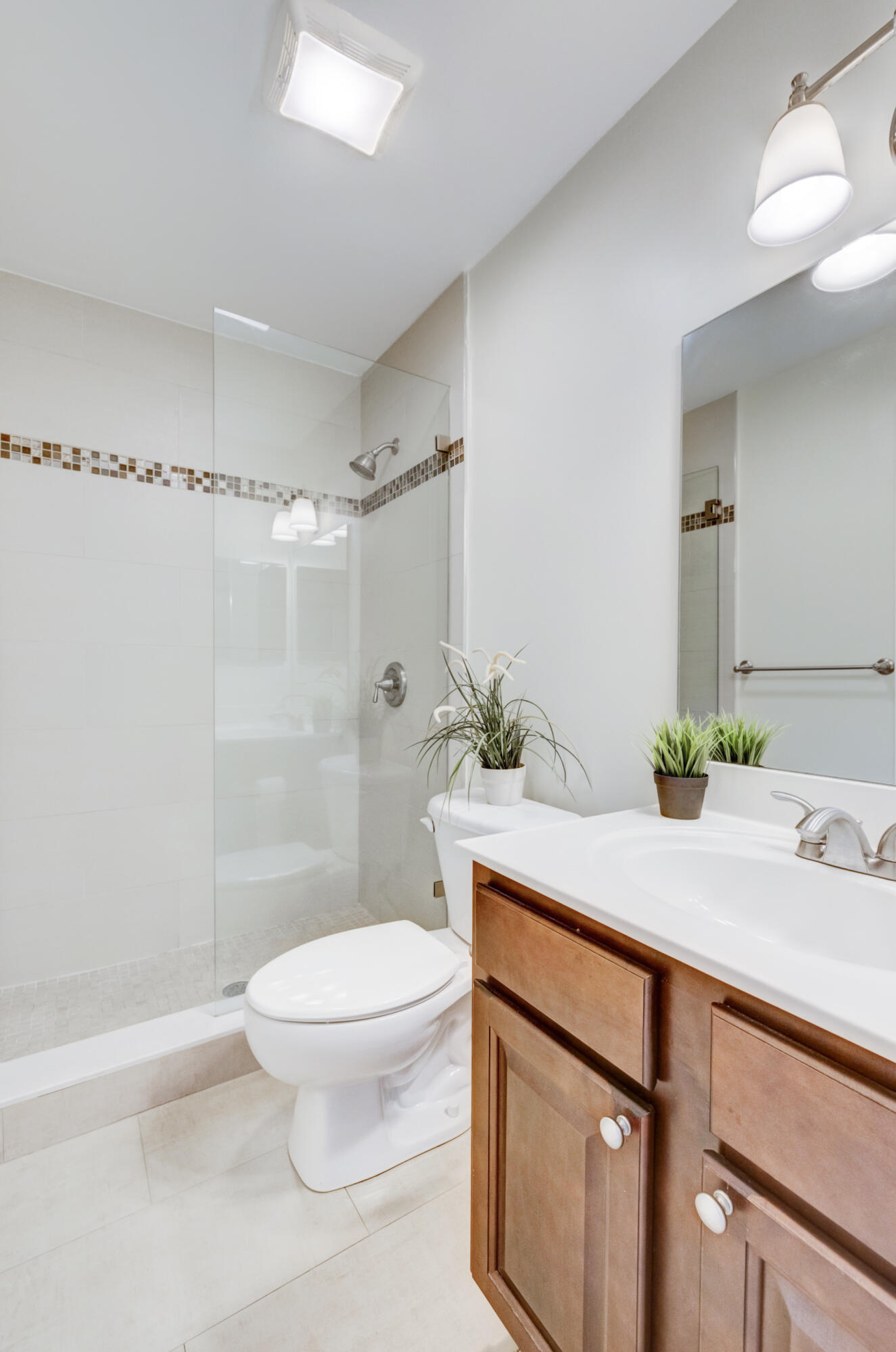 995 Riverside Drive, Unit 111 Coral Springs, FL 33071 - Photo 15 of 24 a bathroom with a sink a toilet and shower