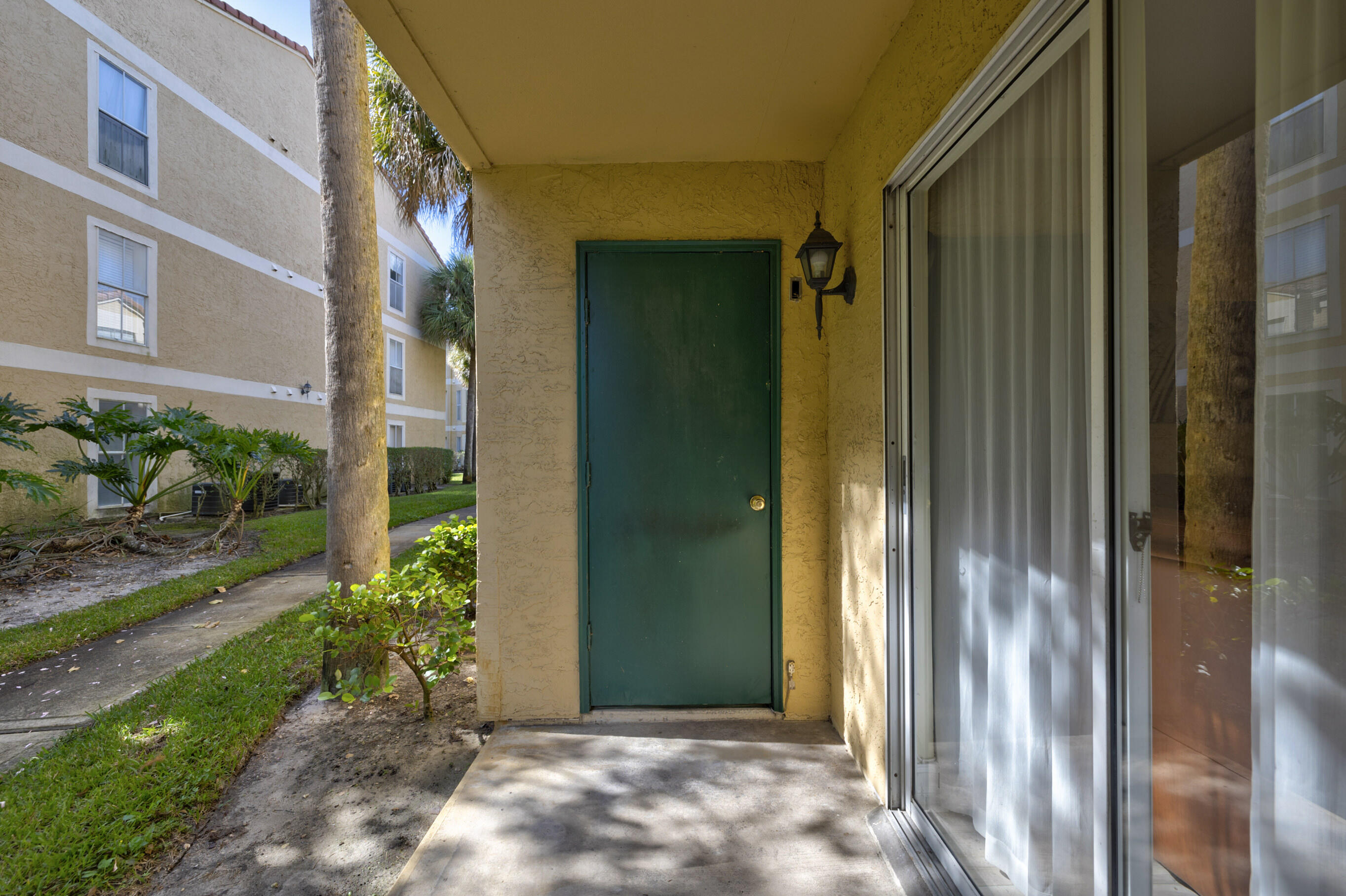 995 Riverside Drive, Unit 111 Coral Springs, FL 33071 - Photo 21 of 24 a view of a front door of house