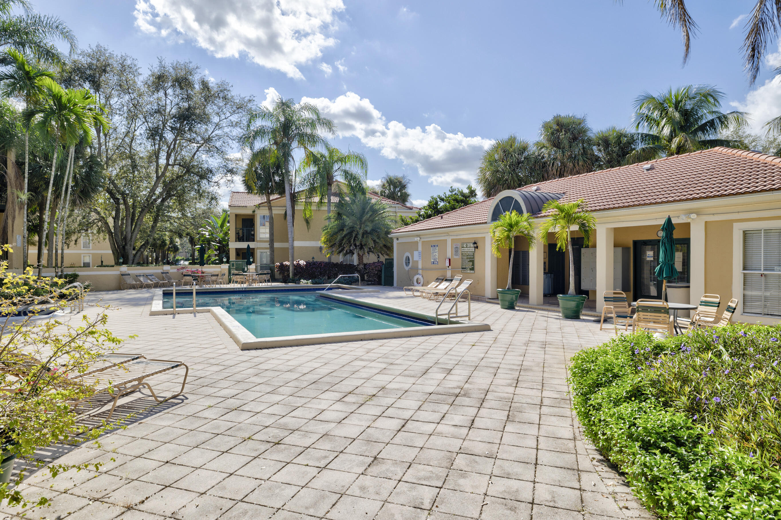 995 Riverside Drive, Unit 111 Coral Springs, FL 33071 - Photo 24 of 24 a view of a house with backyard porch and sitting area