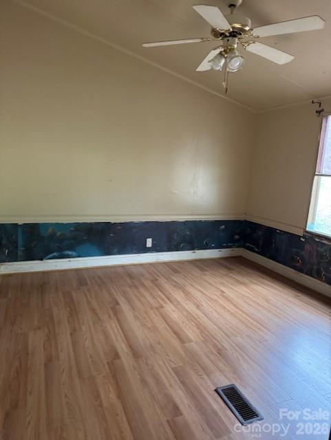 1216 Raxter Road Edgemoor, SC 29712 - Photo 7 of 20 an empty room with wooden floor fan and windows