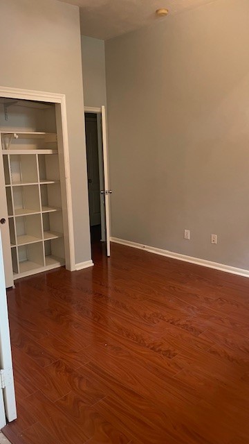 6719 Emerald Shire Lane Houston, TX 77041 - Photo 24 of 37 a view of an empty room with wooden floor and windows