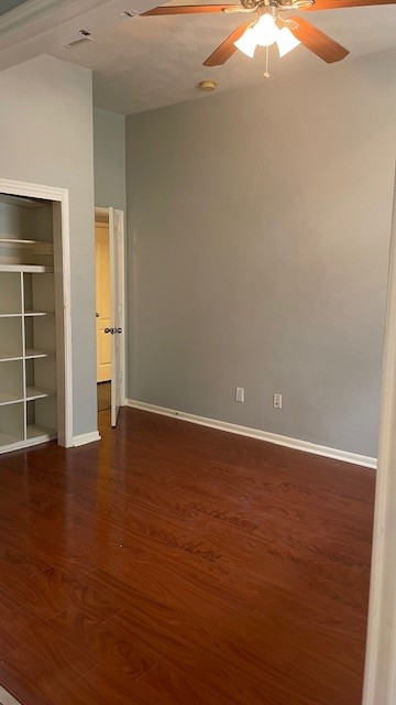 6719 Emerald Shire Lane Houston, TX 77041 - Photo 35 of 37 an empty room with wooden floor and windows