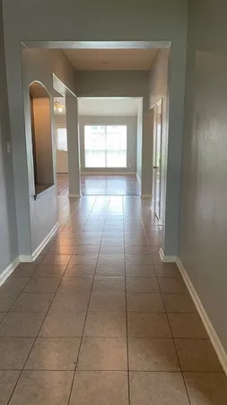 a view of hallway with windows