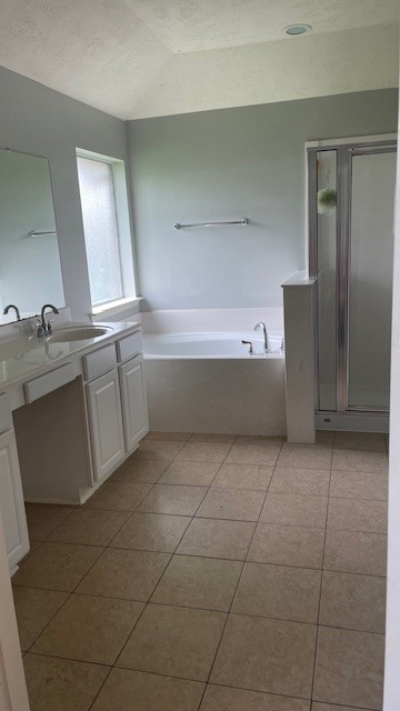 6719 Emerald Shire Lane Houston, TX 77041 - Photo 7 of 37 a bathroom with a granite countertop bathtub sink vanity and mirror